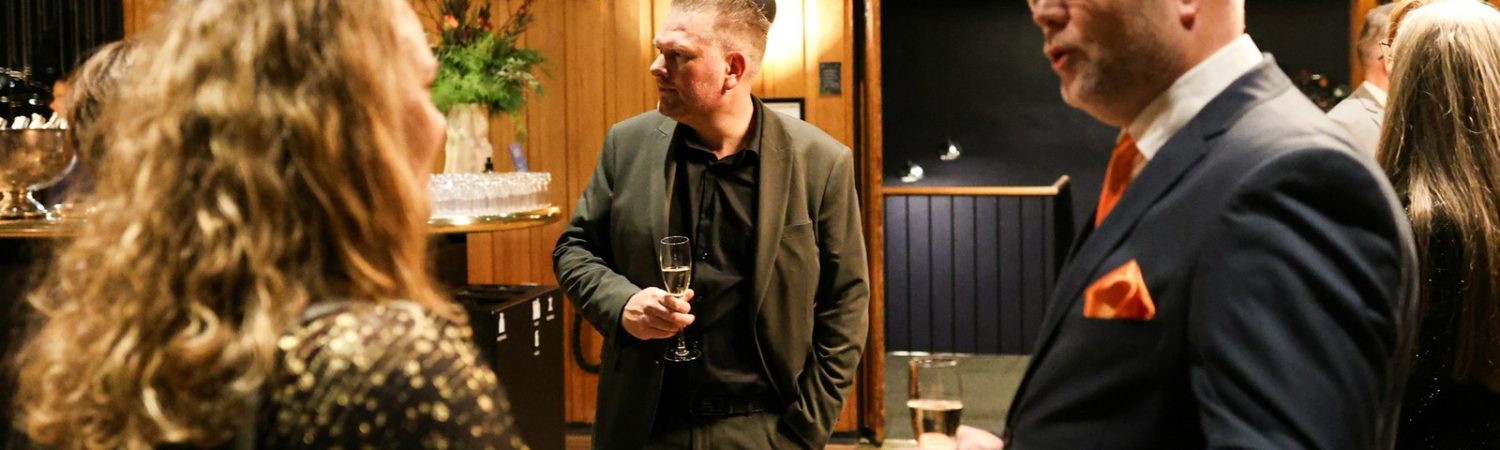 People talking together at a networking event