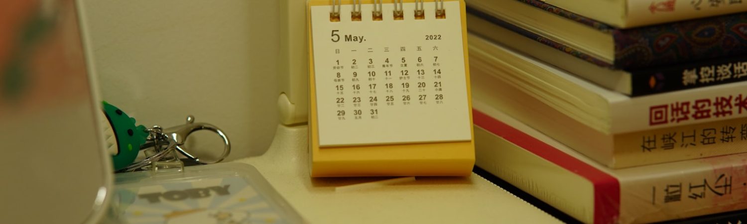 Desk calendar and planning materials on a desk
