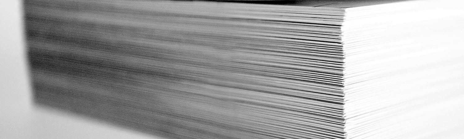 A close view of a tall stack of papers