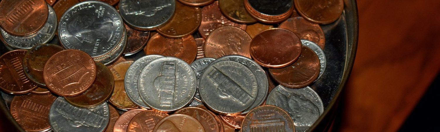 A close view of coins in a jar