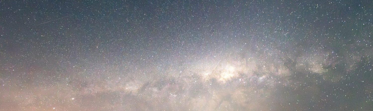 A wide view of the Milky Way and stars in a dark sky